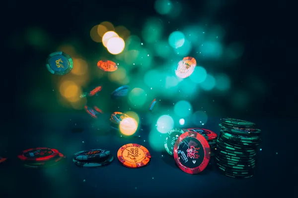 A professional dealer in a tuxedo greeting players at the roulette table, symbolizing the authentic live casino feel at TKPK.